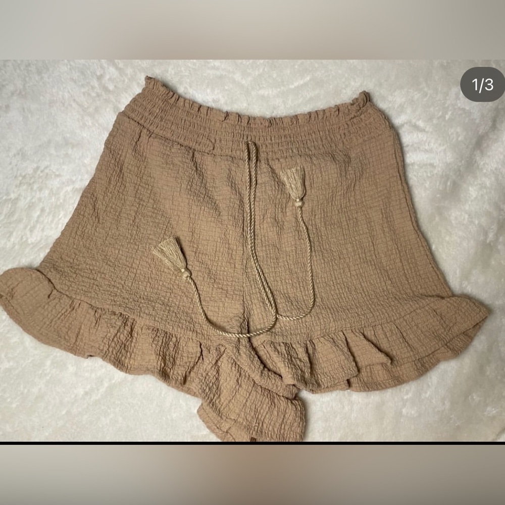Brown shorts with ruffles at bottom